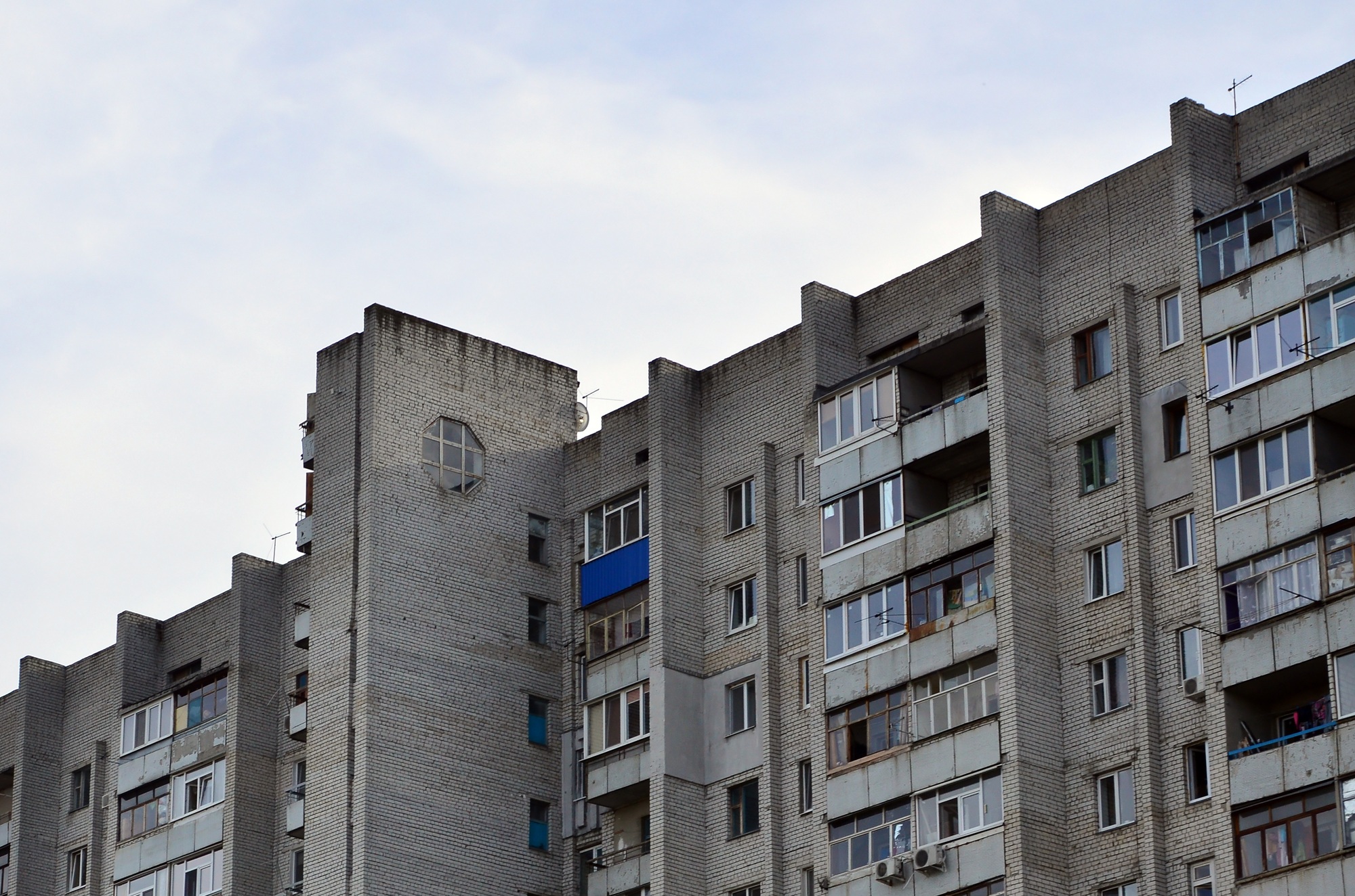 Old multi-storey apartment house in a poorly-developed region of Ukraine or Russia